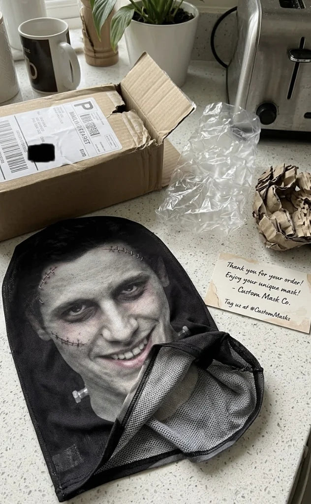 Customer unboxing photo of a personalized monster face balaclava