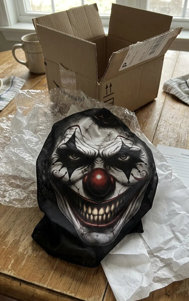 Customer unboxing photo of a clown face balaclava
