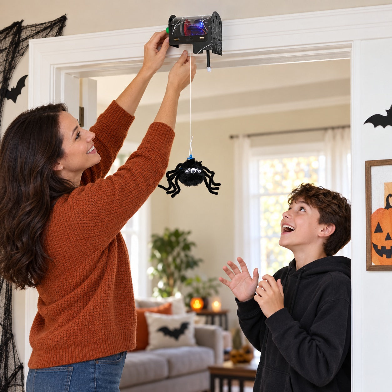 Mounting the completed motion-sensing spider above a doorway